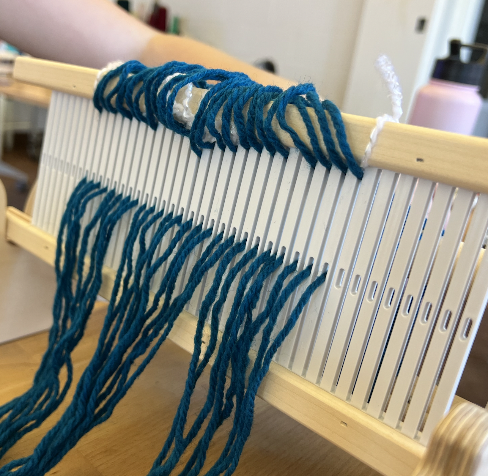 tying the loom onto the book